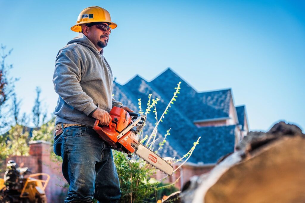 Salas team member with chainsaw