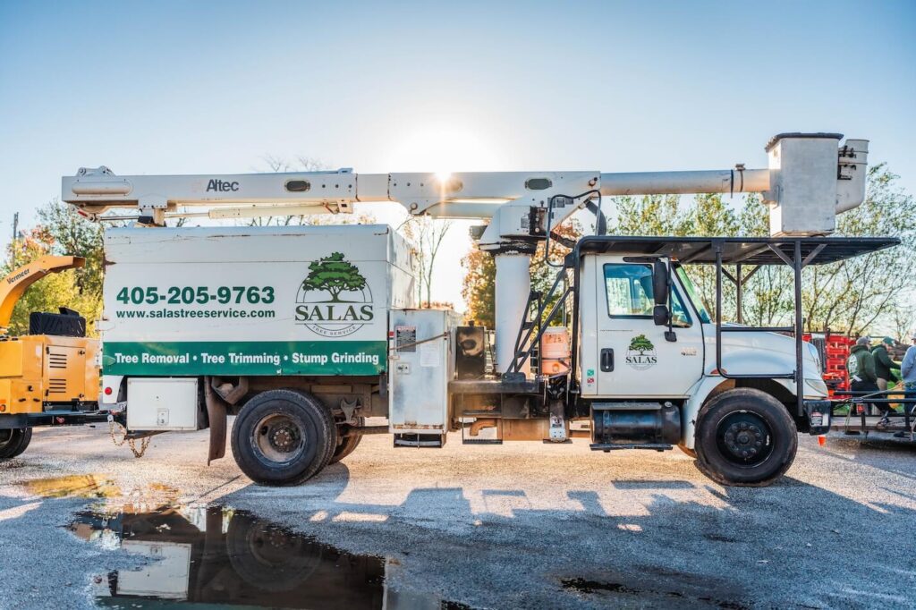 Salas bucket truck from the side showing logo, phone number, and website address